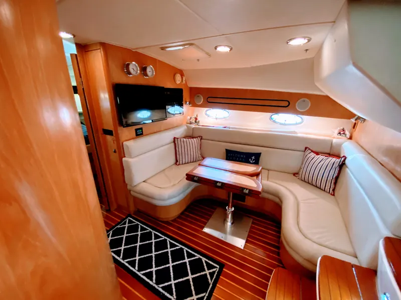 Slide: The Image of Luxurious 2001 Tiara Yachts 3800 Open interior with plush seating and elegant wood finishes. - 29