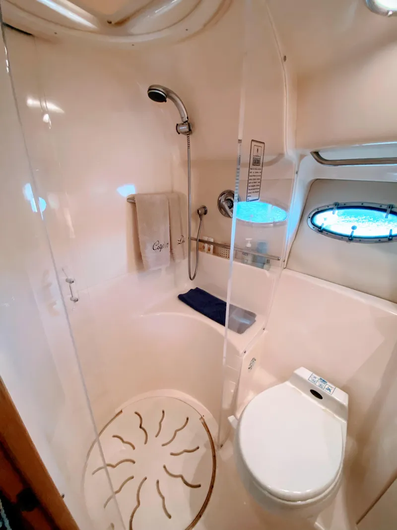 Slide: The Image of Bathroom interior of 2001 Tiara Yachts 3800 Open, featuring shower and toilet. - 43