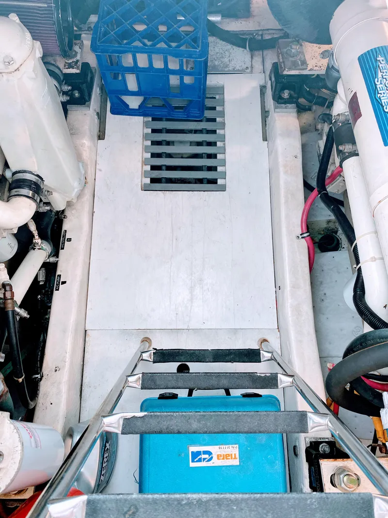 Slide: The Image of Engine room of 2001 Tiara Yachts 3800 Open with equipment and ladder. - 48
