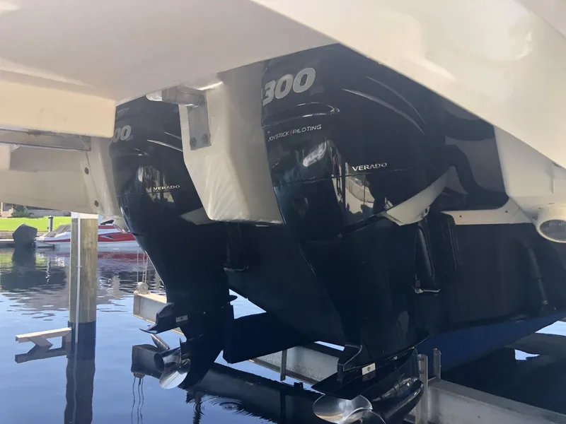 Slide: The Image of 2014 Sea Ray 370 Venture with twin 300 horsepower outboard engines. - 13