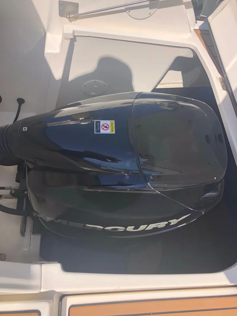 Slide: The Image of 2014 Sea Ray 370 Venture boat engine compartment with Mercury outboard motor. - 15
