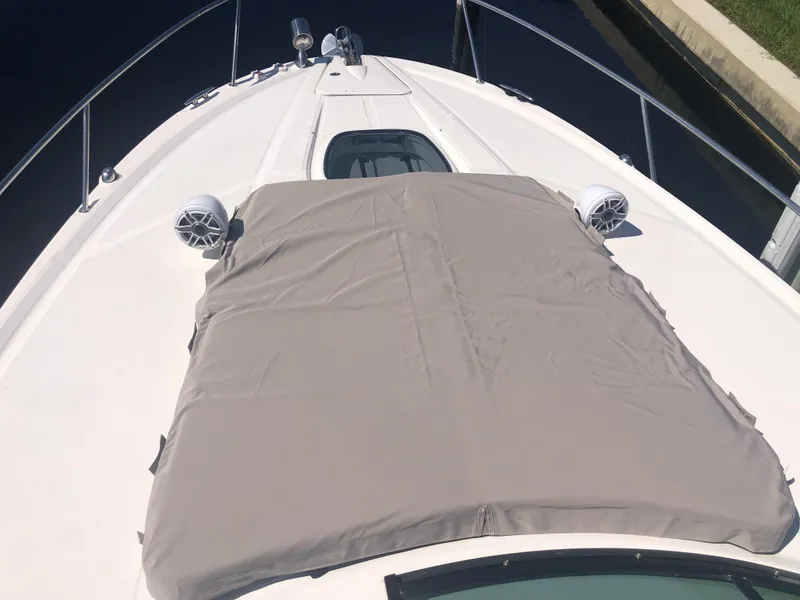Slide: The Image of 2014 Sea Ray 370 Venture boat deck with sunpad and speakers. - 22