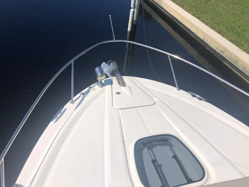 Slide: The Image of 2014 Sea Ray 370 Venture boat bow view at dock. - 23