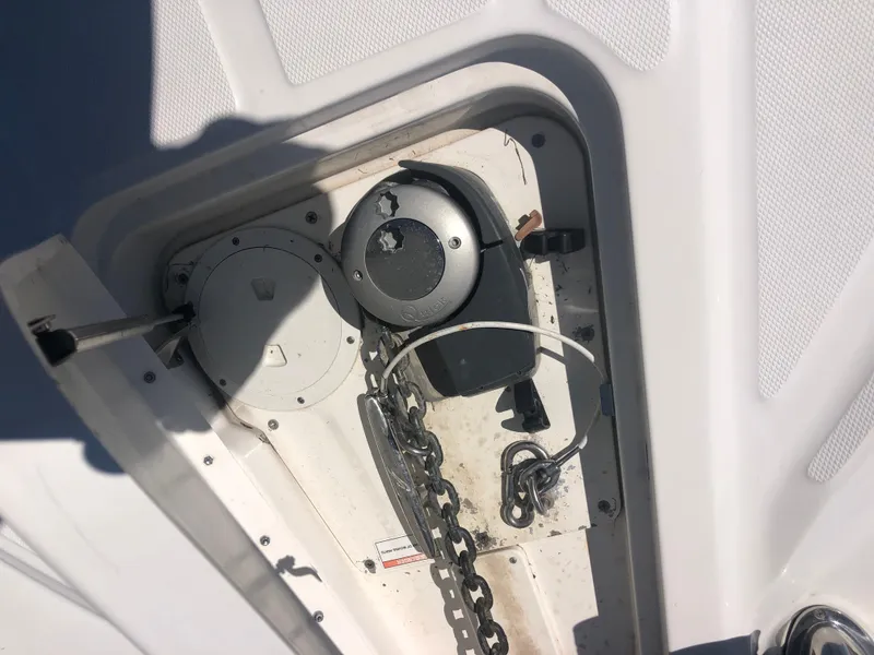 Slide: The Image of 2014 Sea Ray 370 Venture anchor chain compartment with winch mechanism. - 24