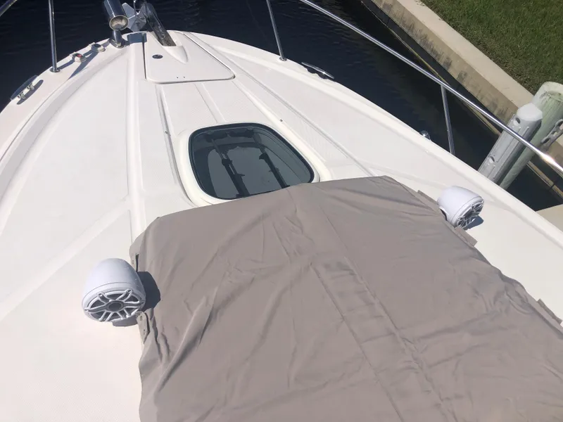 Slide: The Image of 2014 Sea Ray 370 Venture boat deck with speakers and hatch. - 26