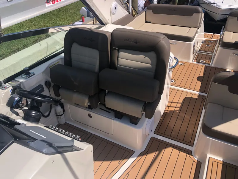 Slide: The Image of 2014 Sea Ray 370 Venture boat interior with cushioned seating and teak flooring. - 27