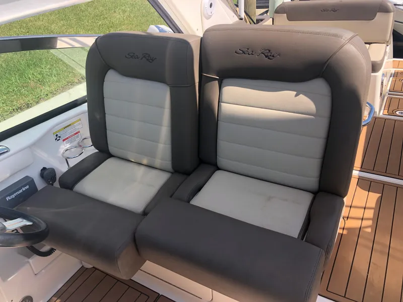 Slide: The Image of 2014 Sea Ray 370 Venture boat seats with gray and white upholstery. - 32