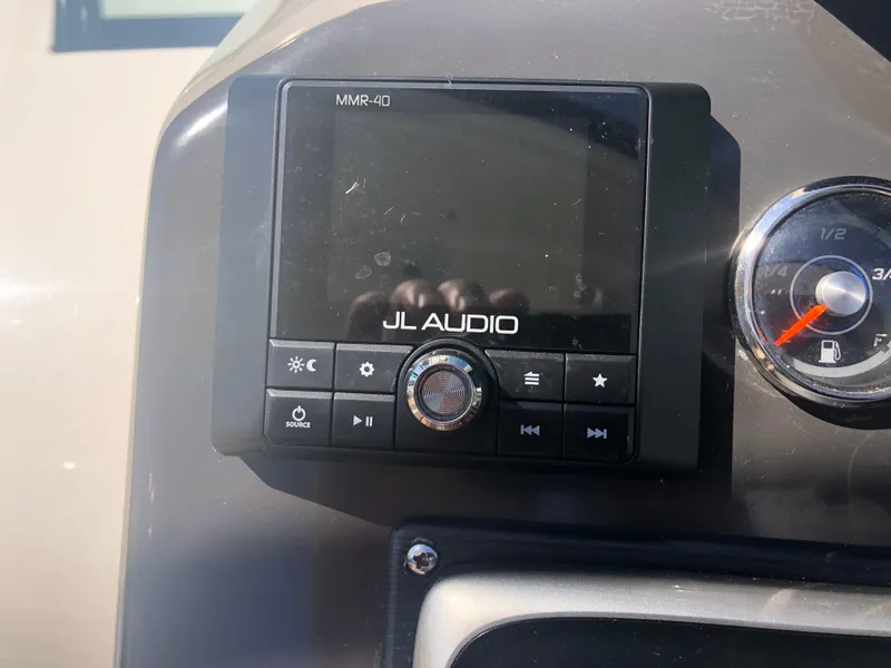 Slide: The Image of JL Audio MMR-40 control panel on 2014 Sea Ray 370 Venture boat dashboard. - 35