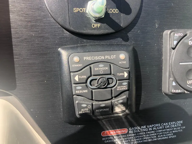 Slide: The Image of Control panel of a 2014 Sea Ray 370 Venture boat with Precision Pilot system. - 36