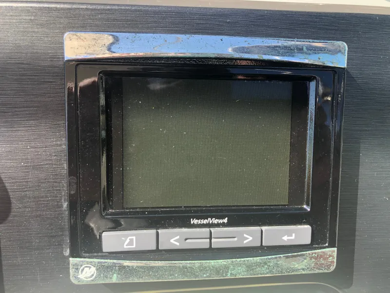 Slide: The Image of 2014 Sea Ray 370 Venture VesselView4 display screen with control buttons. - 38
