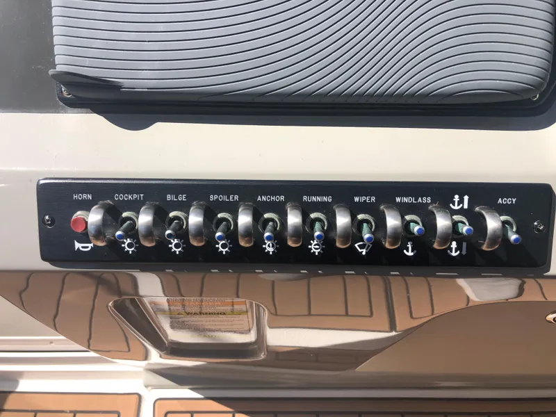 Slide: The Image of Control panel of 2014 Sea Ray 370 Venture boat with labeled switches. - 40