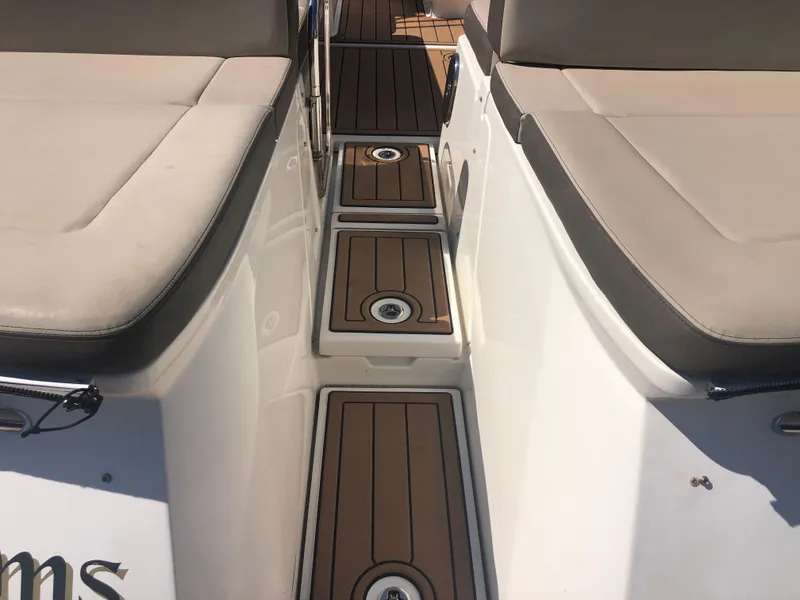 Slide: The Image of 2014 Sea Ray 370 Venture boat interior with cushioned seating and teak flooring. - 45