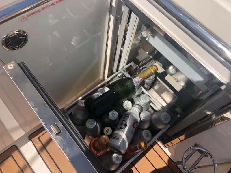 Slide: The Image of Beverage cooler on 2014 Sea Ray 370 Venture boat, stocked with drinks. - 48