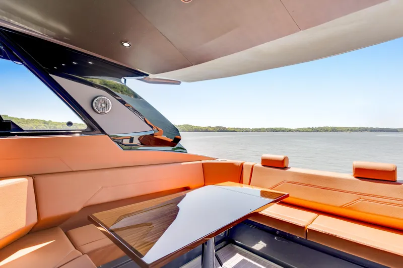 Slide: The Image of Luxurious 2023 Cruisers Yachts 42 GLS interior with elegant seating and scenic water view. - 19