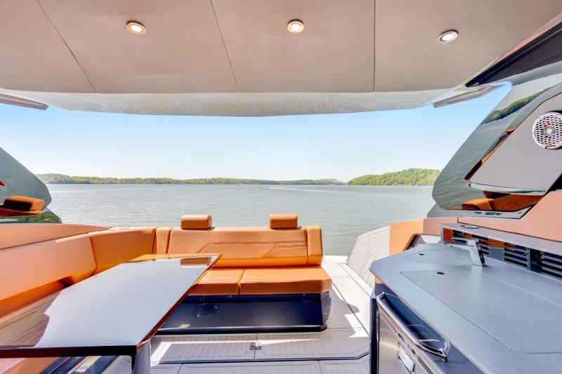 Slide: The Image of Luxurious 2023 Cruisers Yachts 42 GLS interior with lake view, featuring modern seating and amenities. - 20