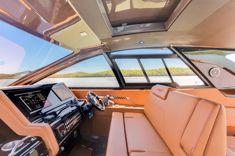 Slide: The Image of Interior of 2023 Cruisers Yachts 42 GLS, featuring modern helm and luxurious seating. - 22