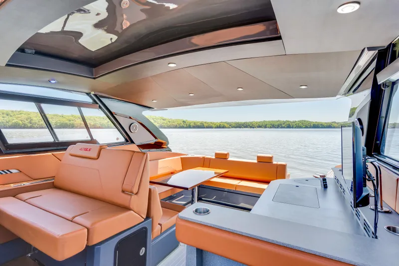 Slide: The Image of Luxurious interior of 2023 Cruisers Yachts 42 GLS with lake view and modern amenities. - 23