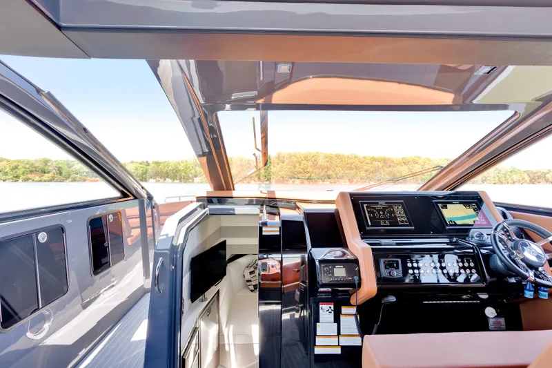 Slide: The Image of 2023 Cruisers Yachts 42 GLS helm with advanced navigation systems and luxurious interior. - 25