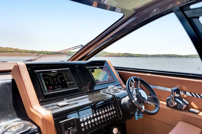 Slide: The Image of 2023 Cruisers Yachts 42 GLS helm with advanced navigation and control systems. - 26