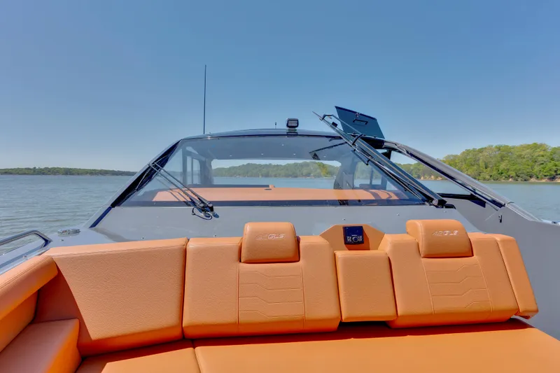 Slide: The Image of 2023 Cruisers Yachts 42 GLS on water, featuring orange seating and sleek design. - 29