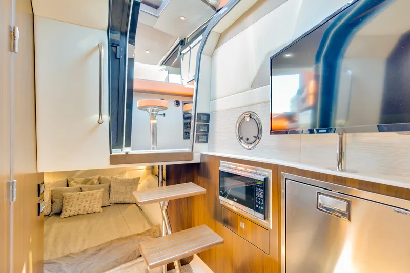 Slide: The Image of Luxurious interior of 2023 Cruisers Yachts 42 GLS with modern amenities and cozy sleeping area. - 36