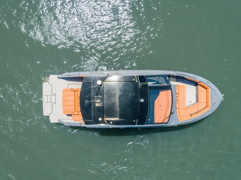 Slide: The Image of Aerial view of 2023 Cruisers Yachts 42 GLS on water, showcasing sleek design and spacious deck. - 4