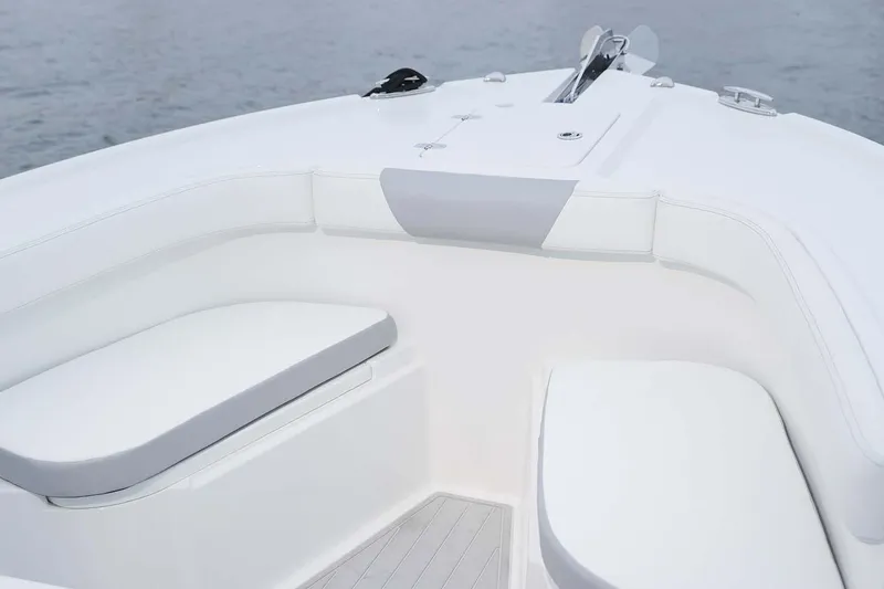 Slide: The Image of 2025 Parker 2400 Center Console boat with 300 V6 engine in showroom. - 2