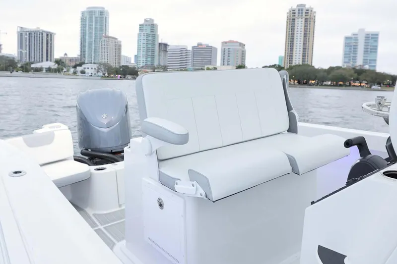 Slide: The Image of 2025 Parker 2400 Center Console boat interior with Yamaha engine in showroom. - 3