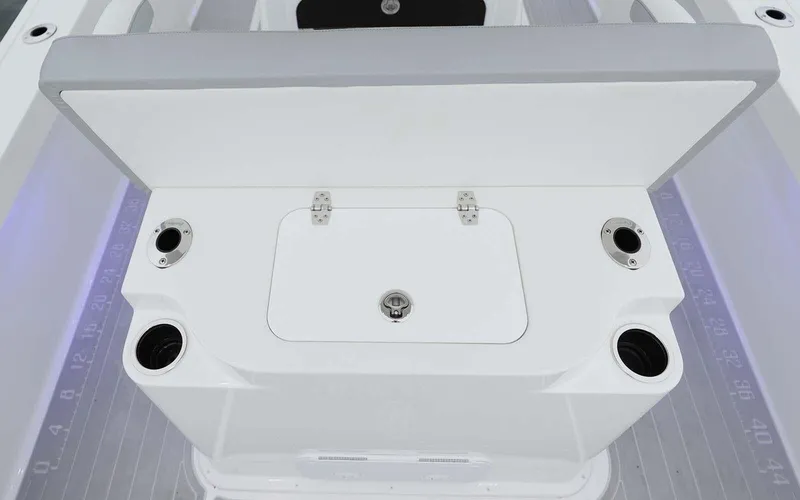 Slide: The Image of 2025 Parker 2400 Center Console boat interior with T-top and storage compartments. - 5