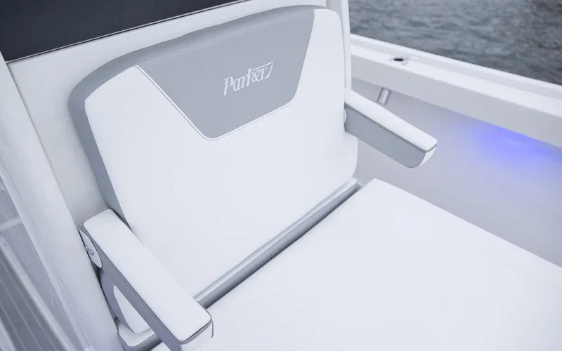 Slide: The Image of 2025 Parker 2400 Center Console boat interior with steering wheel and seating. - 7
