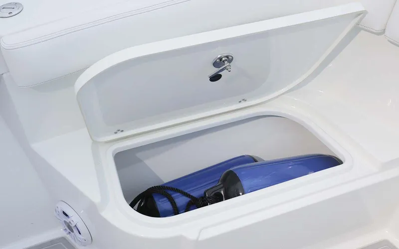 Slide: The Image of 2025 Parker 2400 Center Console boat dashboard with steering wheel and control panel. - 8