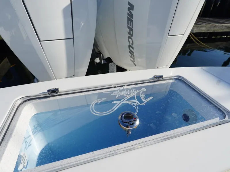 Slide: The Image of 2024 Albemarle 30 Express boat with Mercury engines and a clear livewell lid. - 17