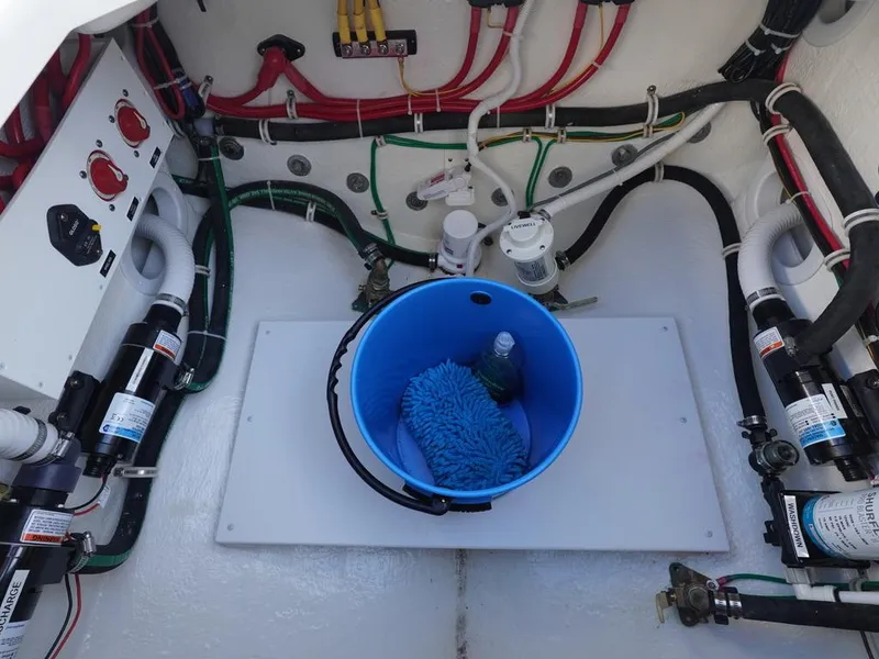 Slide: The Image of 2024 Albemarle 30 Express engine compartment with wiring and maintenance tools. - 19