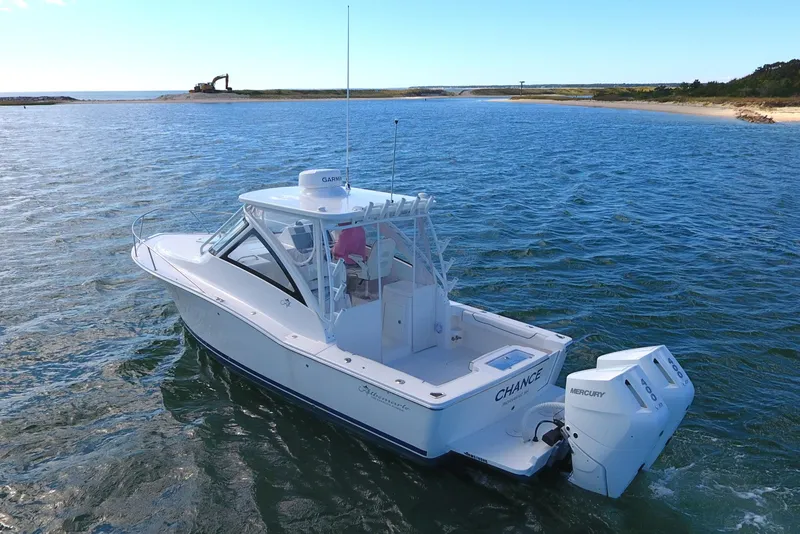 Slide: The Image of 2024 Albemarle 30 Express boat on open water, featuring twin Mercury engines. - 2