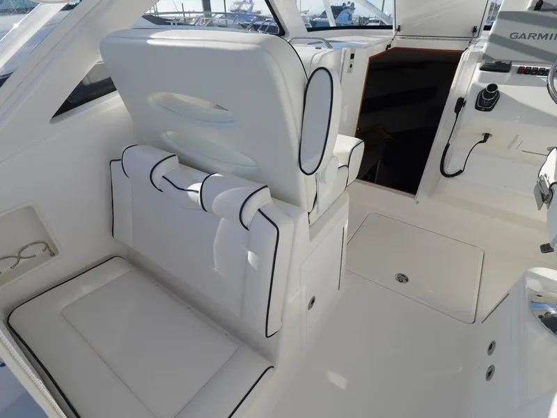 Slide: The Image of 2024 Albemarle 30 Express boat interior with white seating and modern controls. - 20