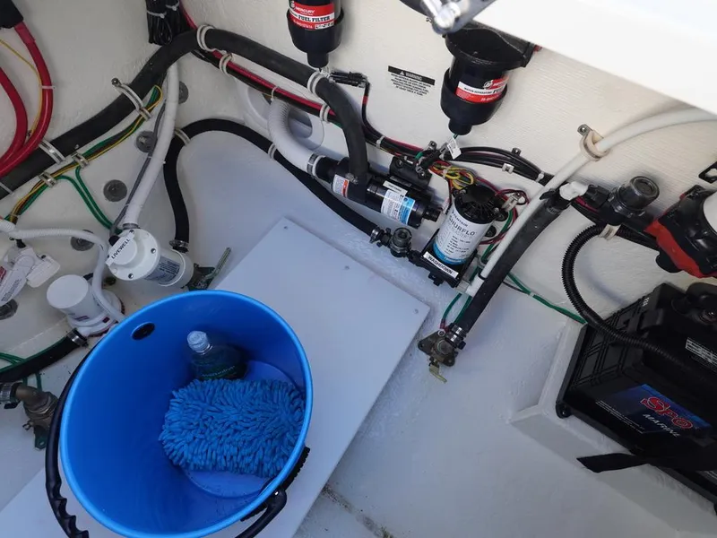 Slide: The Image of Engine compartment of 2024 Albemarle 30 Express with wiring and maintenance tools. - 22