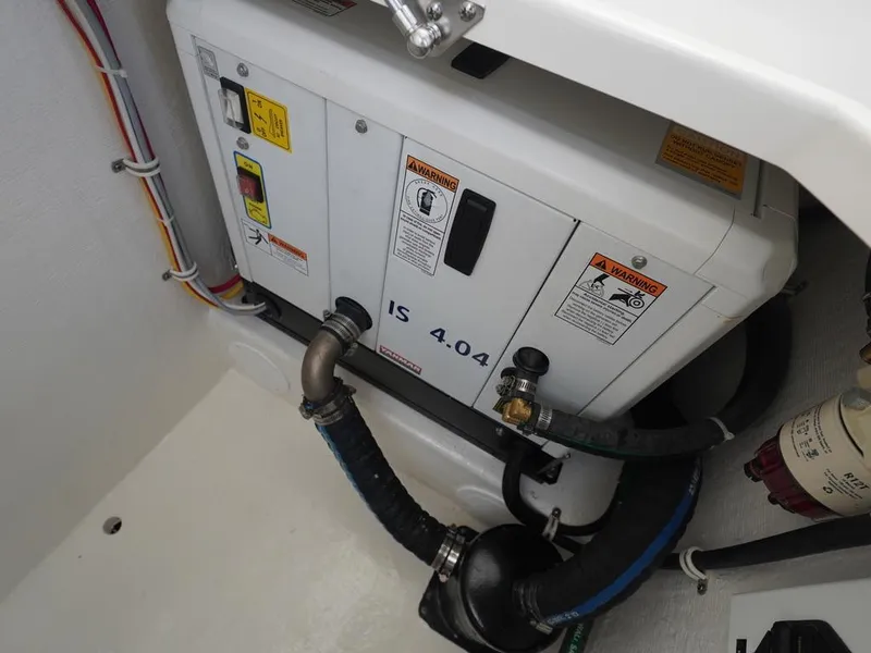 Slide: The Image of 2024 Albemarle 30 Express engine compartment with generator and wiring. - 23