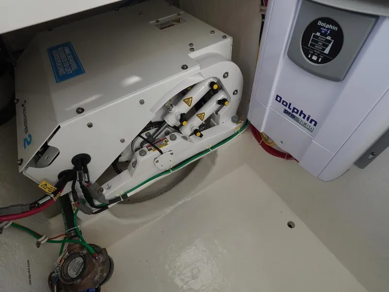 Slide: The Image of 2024 Albemarle 30 Express engine compartment with Dolphin marine equipment. - 24