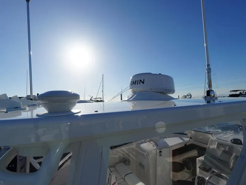 Slide: The Image of 2024 Albemarle 30 Express boat with Garmin equipment under a bright sunlit sky. - 25