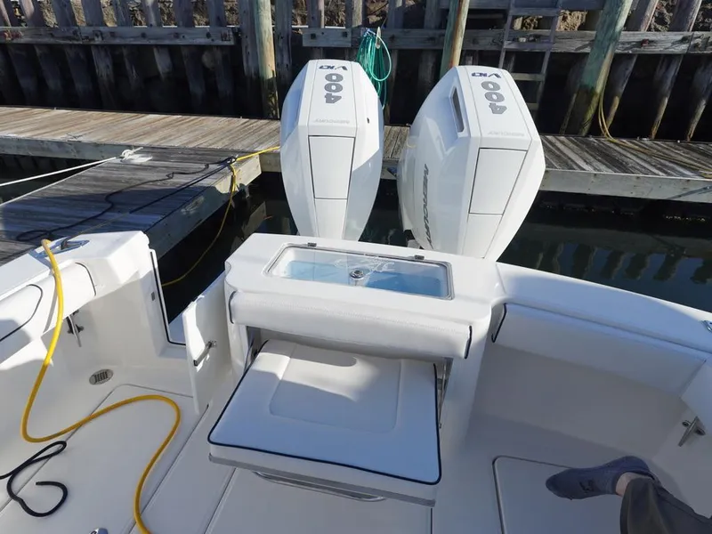 Slide: The Image of 2024 Albemarle 30 Express boat with dual outboard engines at dock. - 27