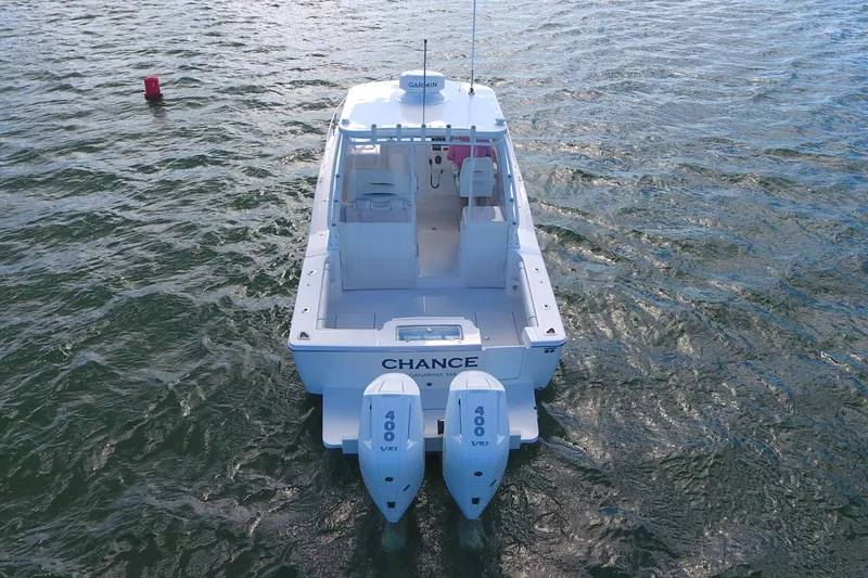 Slide: The Image of 2024 Albemarle 30 Express boat with twin 400 engines on open water. - 3