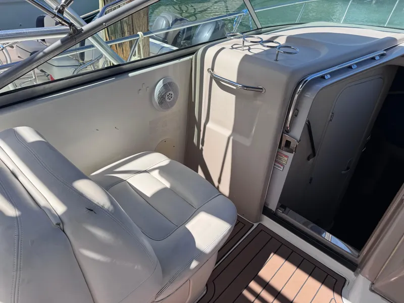 Slide: The Image of 2004 Sea Ray 290 Amberjack boat interior with seating and cabin entrance. - 8