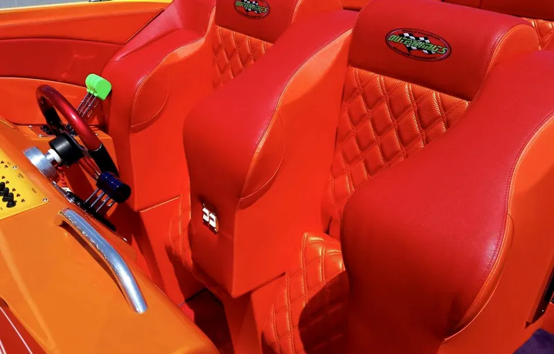 Slide: The Image of Red and orange interior of 2005 Outerlimits 51 Sport Yacht with quilted seats. - 3