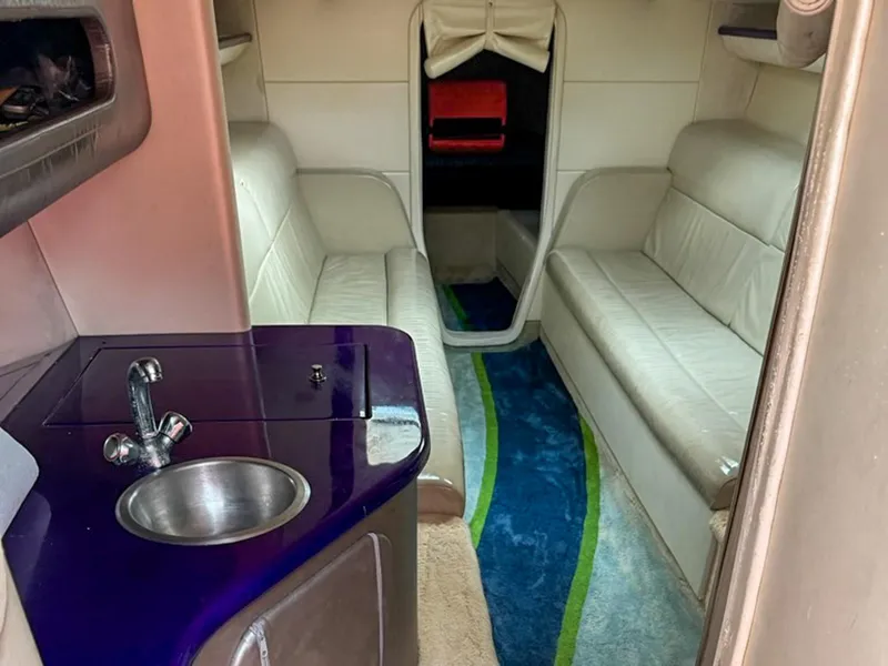 Slide: The Image of Interior of 2005 Outerlimits 51 Sport Yacht with modern seating and compact sink area. - 4