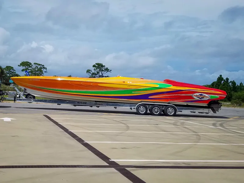 Slide: The Image of Colorful 2005 Outerlimits 51 Sport Yacht on trailer in parking lot. - 9