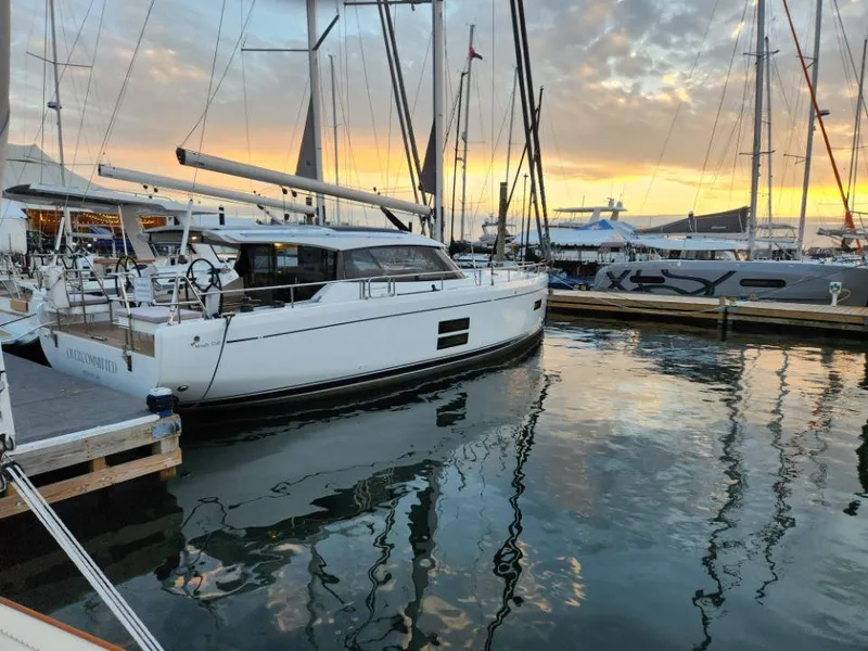 Slide: The Image of Sailing yacht Moody 41 DS 2025 docked at sunset in a marina. - 14