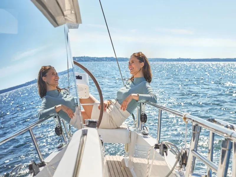 Slide: The Image of Woman relaxing on a 2025 Moody 41 DS yacht, enjoying a sunny day at sea. - 16