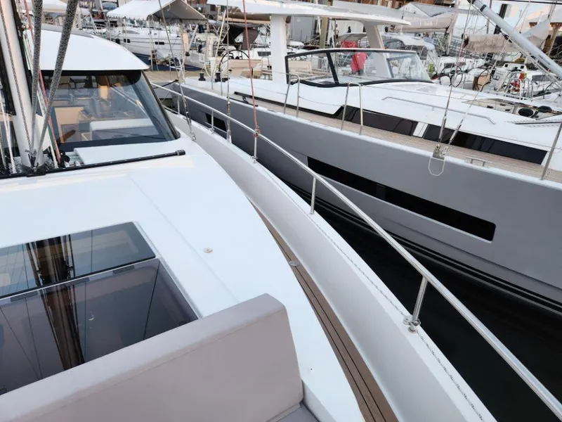 Slide: The Image of Modern Moody 41 DS yachts docked side by side, showcasing sleek design and luxury features. - 20