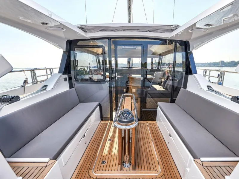 Slide: The Image of Luxurious 2025 Moody 41 DS yacht interior with sleek seating and elegant wood flooring. - 26