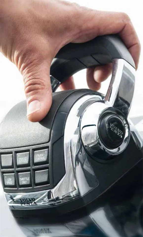 Slide: The Image of Hand operating a Volvo Penta throttle control on a 2025 Moody 41 DS yacht. - 27